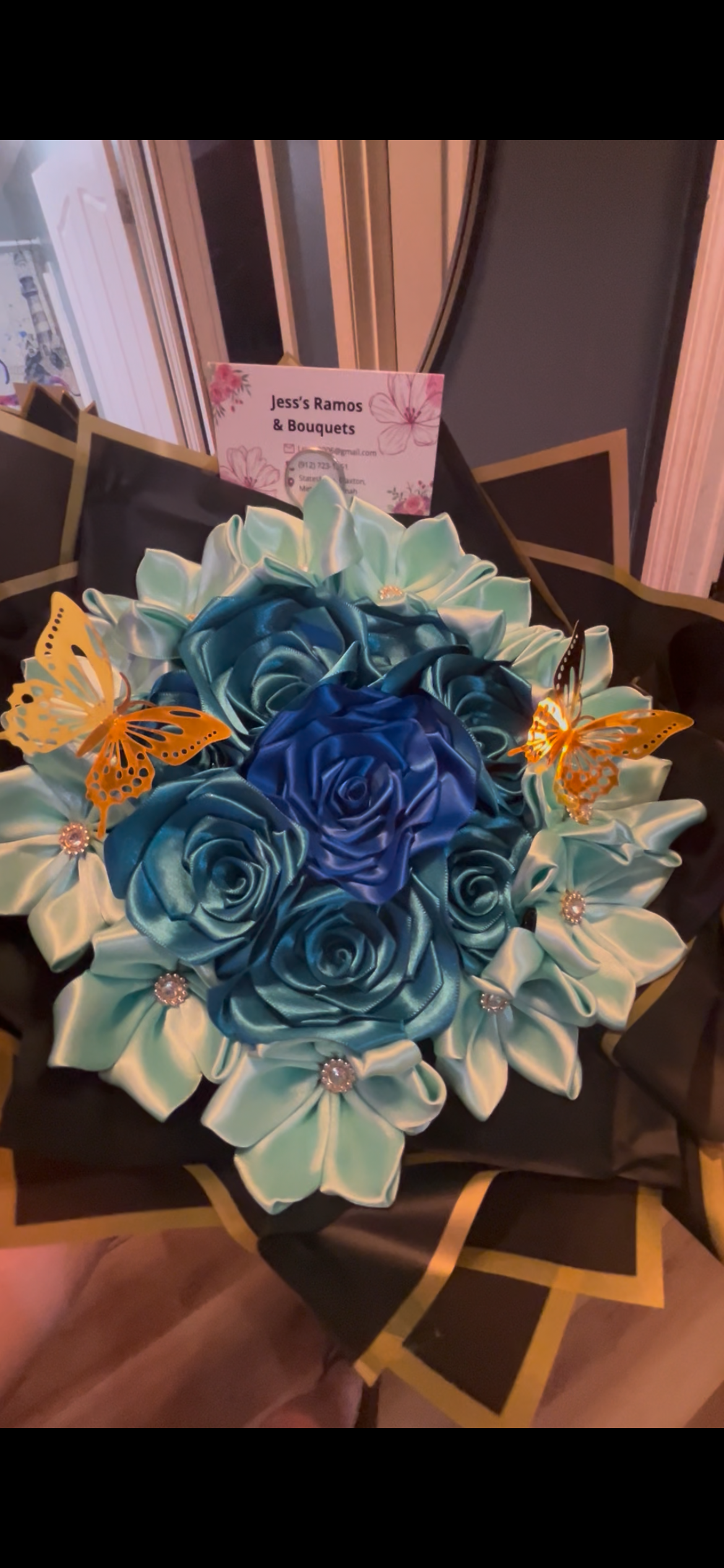 Teal and navy blue ribbon rose bouquet with gold butterfly accents